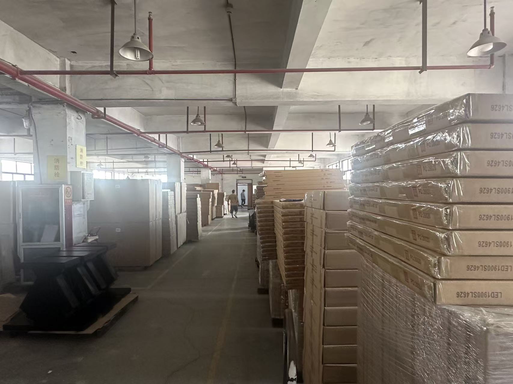 Packing area at the factory, finished cartons staged for loading